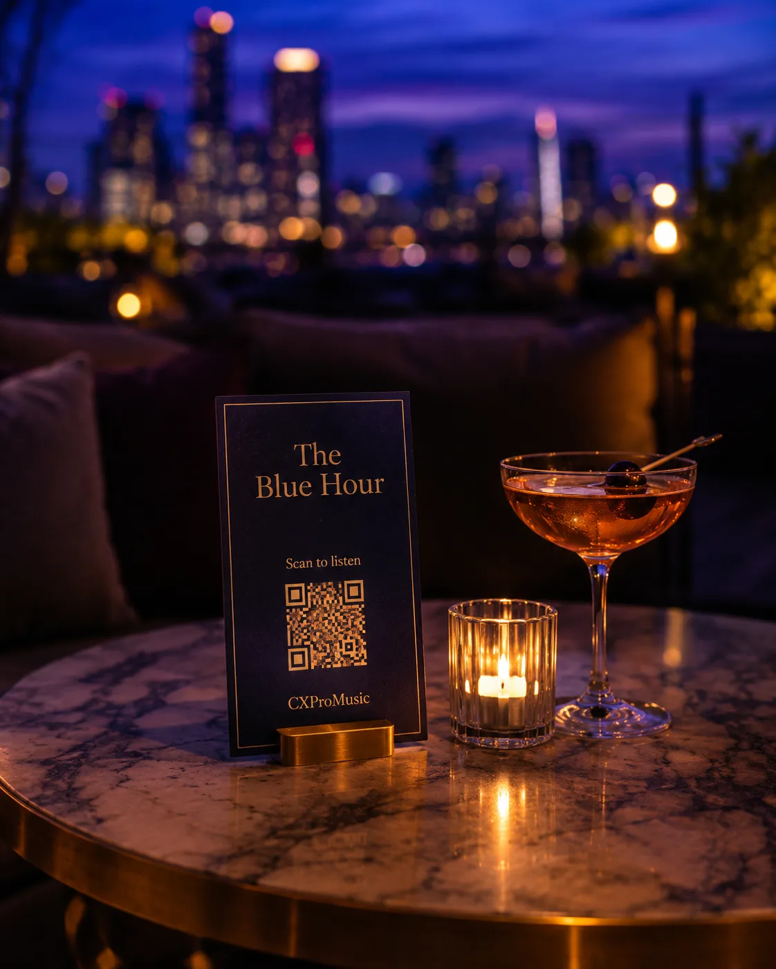 A table card on a low lounge table beside a cocktail.