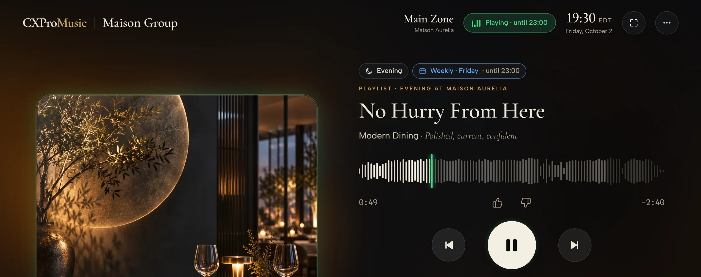 The Venue Player in Main Zone at 19:30 on a Friday, playing until 23:00 on the weekly schedule: “No Hurry From Here” from Evening at Maison Aurelia, with its waveform, thumbs, previous, pause and next